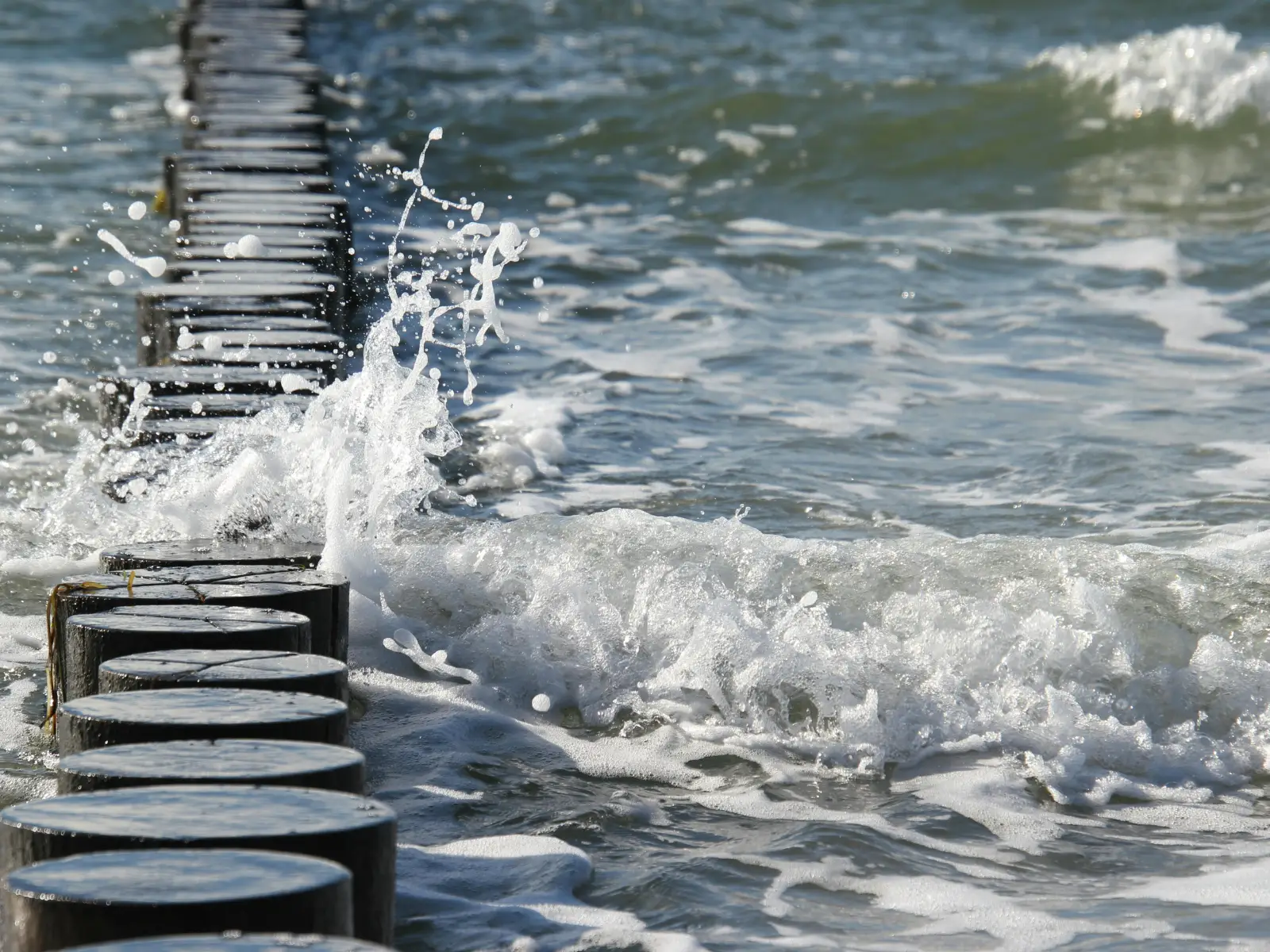Water breaking through a cracked stone pathway, symbolizing a market breaking point and 2026 midterm election stock market risk